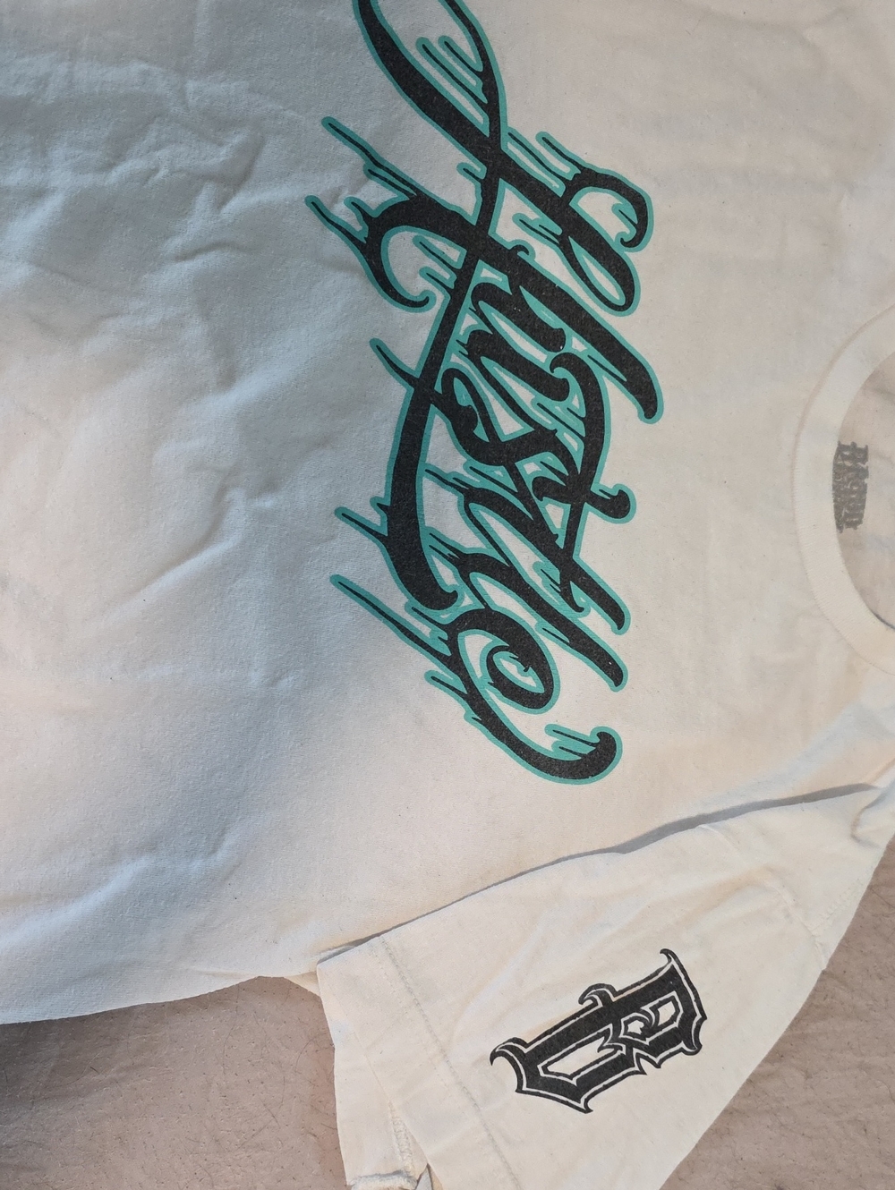 Hustler Hollywood White Tee with Teal and Black Script